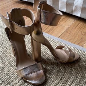 Rose gold chunky heel wide ankle strap sandals.